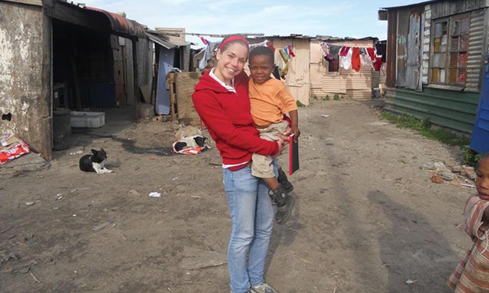 Katherine Wegman ’15 holding child in South Africa
